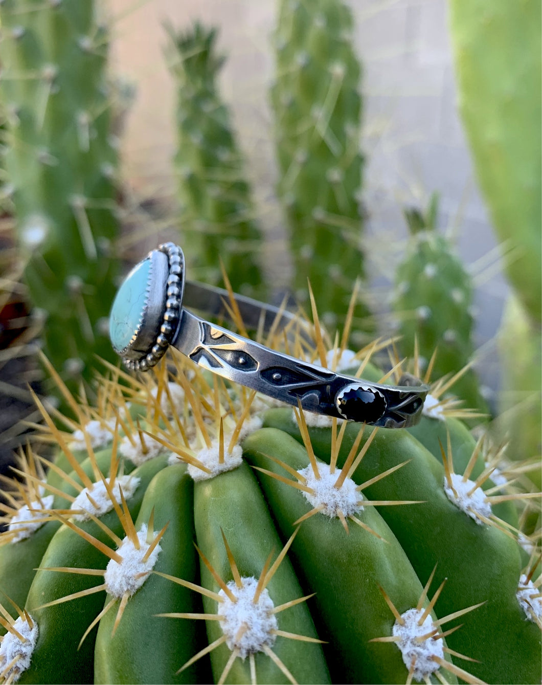 Turquoise tear and black onyx cuff bracelet